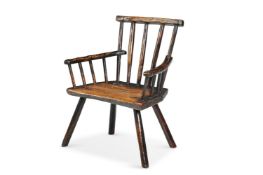 AN ELM PRIMITIVE STICK BACK ARMCHAIR, POSSIBLY IRISH, 18TH CENTURY