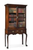A GEORGE II MAHOGANY BOOKCASE OR CABINET ON STAND, CIRCA 1740