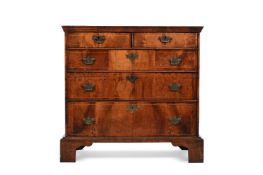 A GEORGE I WALNUT AND LINE INLAID CHEST OF DRAWERS, CIRCA 1720