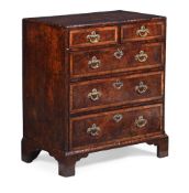 A GEORGE II BURR YEW, WALNUT AND LABURNUM CHEST OF DRAWERS, CIRCA 1740