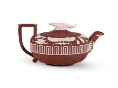 A WEDGWOOD RED DRY-BODIED STONEWARE WHITE-SPRIGGED EGYPTIAN TASTE TEAPOT AND COVER