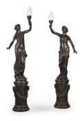 A LARGE PAIR OF BARBEDIENNE STYLE BRONZE FEMALE FIGURAL TORCHERES, MODERN