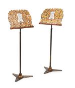 A PAIR OF GEORGE IV FRET CARVED GILTWOOD, JAPANNED AND BRASS ADJUSTABLE MUSIC STANDS, CIRCA 1825