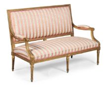 A CARVED GILTWOOD SETTEE, IN GEORGE III STYLE, 19TH CENTURY