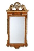 A GEORGE II WALNUT AND PARCEL GILT MIRROR, CIRCA 1750
