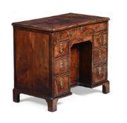 A GEORGE II BURR YEW, WALNUT AND CROSSBANDED KNEEHOLE DESK, CIRCA 1740