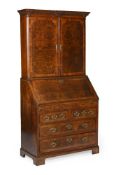 A GEORGE II POLLARD OAK, WALNUT AND CHEQUER BANDED BUREAU CABINET, CIRCA 1740