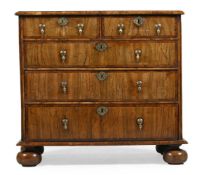 A QUEEN ANNE WALNUT AND YEW WOOD CROSSBANDED CHEST OF DRAWERS, CIRCA 1710