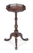 A GEORGE III MAHOGANY AND FRETWORK KETTLE STAND OR WINE TABLE, CIRCA 1780