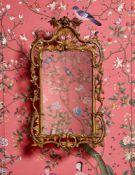 A GEORGE III CARVED GILTWOOD MIRROR, CIRCA 1760