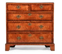 A GEORGE II BURR ASH AND WALNUT CROSSBANDED CHEST OF DRAWERS, CIRCA 1750