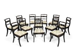 A SET OF TWELVE REGENCY EBONISED AND GILT METAL MOUNTED DINING CHAIRS, CIRCA 1815