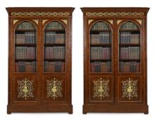 A LARGE PAIR OF EMPIRE 'PLUM PUDDING' MAHOGANY AND ORMOLU MOUNTED BOOKCASES, CIRCA 1810