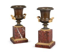 A PAIR OF FRENCH EMPIRE ORMOLU MOUNTED BRONZE CAMPANA URNS, EARLY 19TH CENTURY