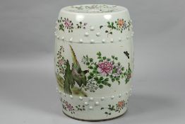 'antique' Chinese garden seat in porcelain with a 'Famille Rose' decor