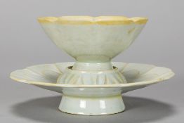 Chinese tea set with cup and saucer, each on a base, in celadon glazed ceramic
