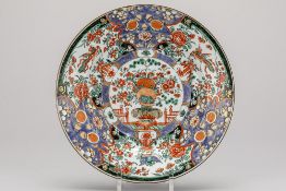 beautiful 18th Cent. Chinese plate in porcelain with a rich Famille Verte decor with a central jardi