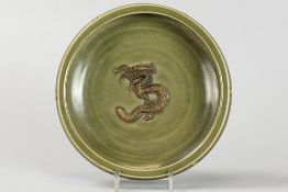 presumably antique Chinese bowl on three feet in glazed earthenware with centrally inside a represen