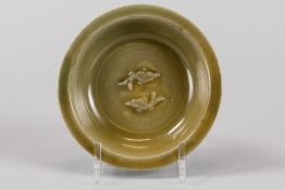antique Chinese, presumably Song period porcelain bowl with khaki-colored glaze and underlying relie