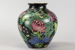 Chinese vase in porcelain with a 'Famille Noire' decor with a floral polychrome decor