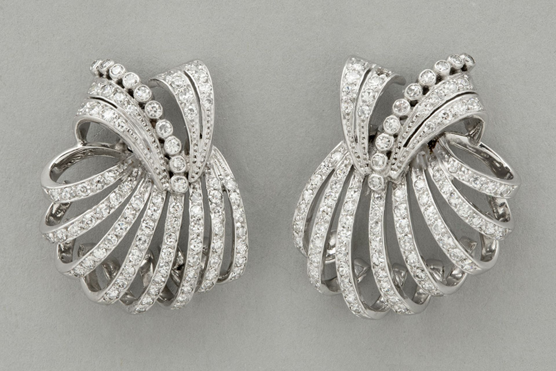pair of earrings with an elegant fan model in platinum with ca 2 carat of high quality brilliant cut