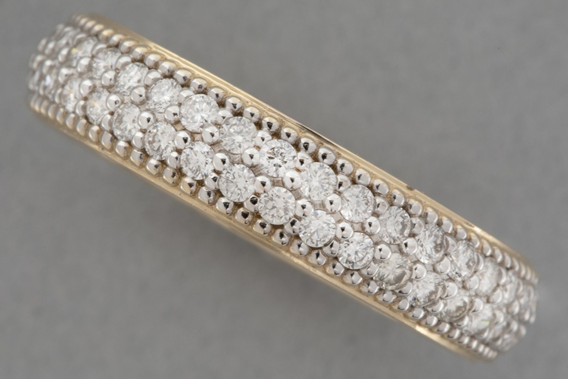 wedding ring in yellow and white gold (18 carat) with ca 1 carat of high quality brilliant cut diamo