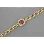 bracelet in yellow gold (18 carat) with a large ca 7 carat red tourmaline surrounded by ca 0,70 cara