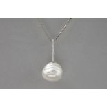 rare big South Sea pearl with a baroque shape  set on a pendant in white gold (18 carat) with ca 0,2