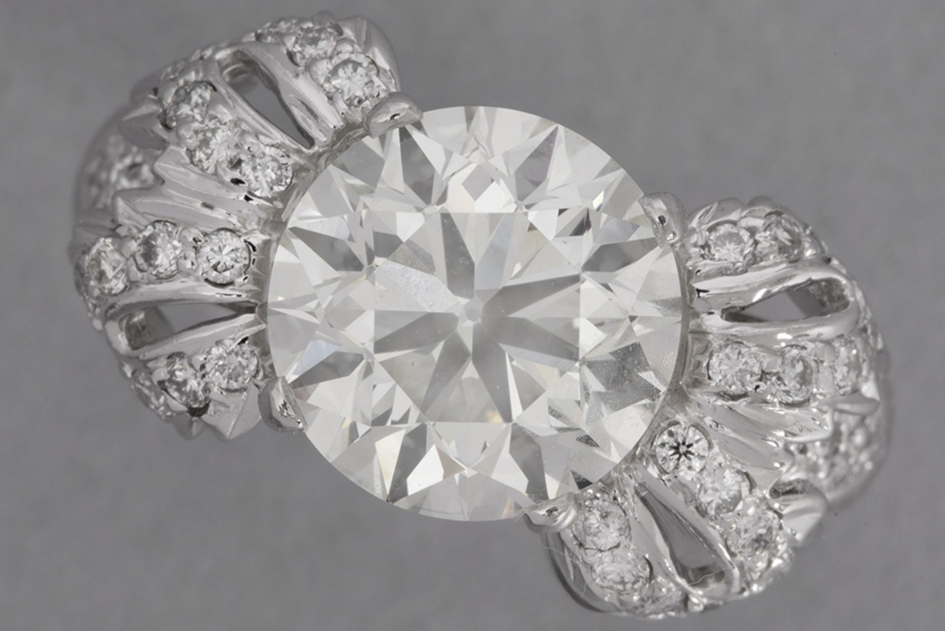 nice and big 4,05 carat high quality brilliant cut diamond set in a forties' style ring in white gol