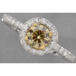 a 0,71 carat natural fancy "Intense Yellow-Orange color high quality brilliant cut diamond set in a 