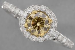 a 0,71 carat natural fancy "Intense Yellow-Orange color high quality brilliant cut diamond set in a