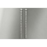 pair of very elegant and 7 cm long earrings in white gold (18 carat) with 2,85 carat of very high qu