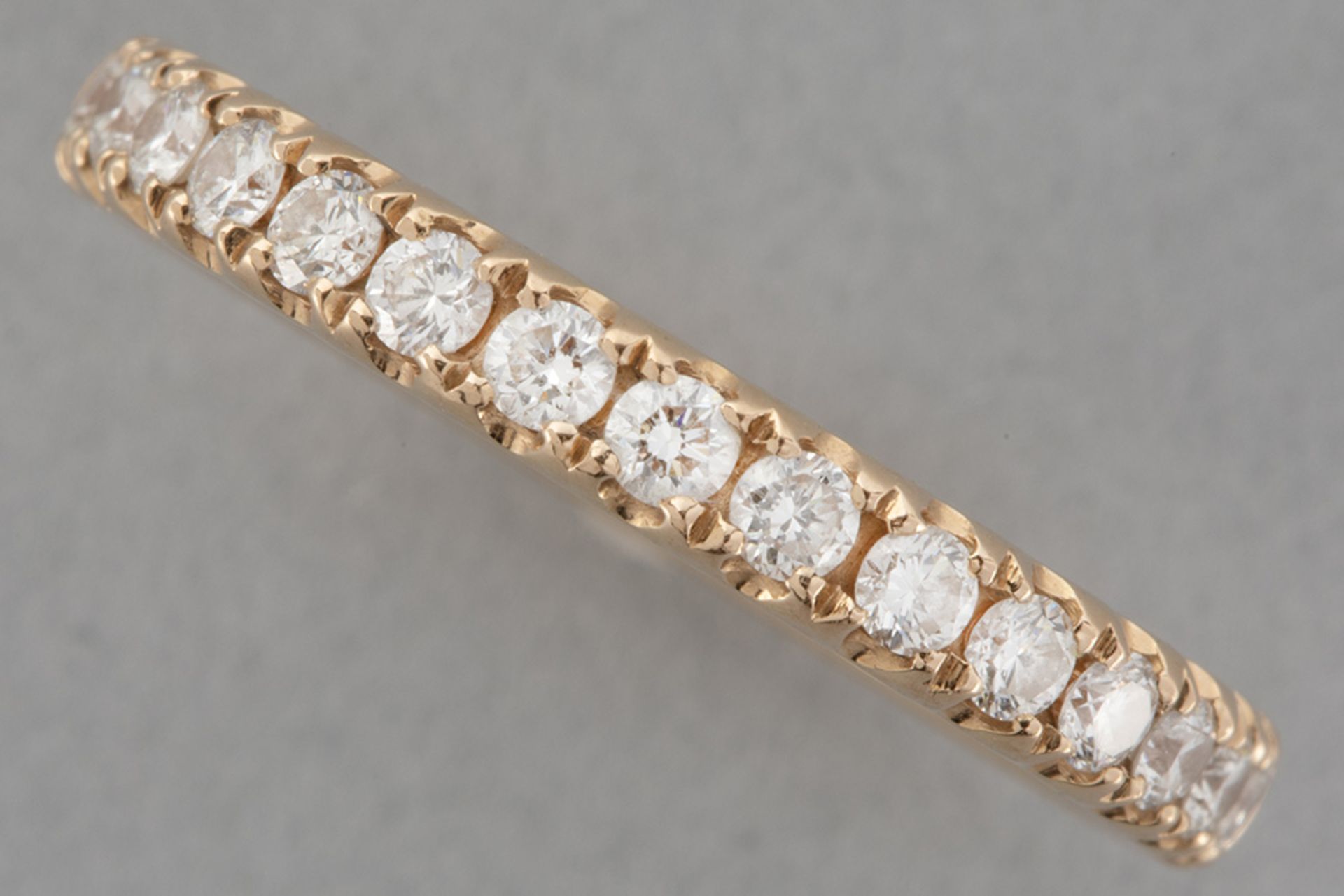 wedding ring in pink gold (18 carat) with ca 0,65 carat of very high quality brilliant cut diamonds