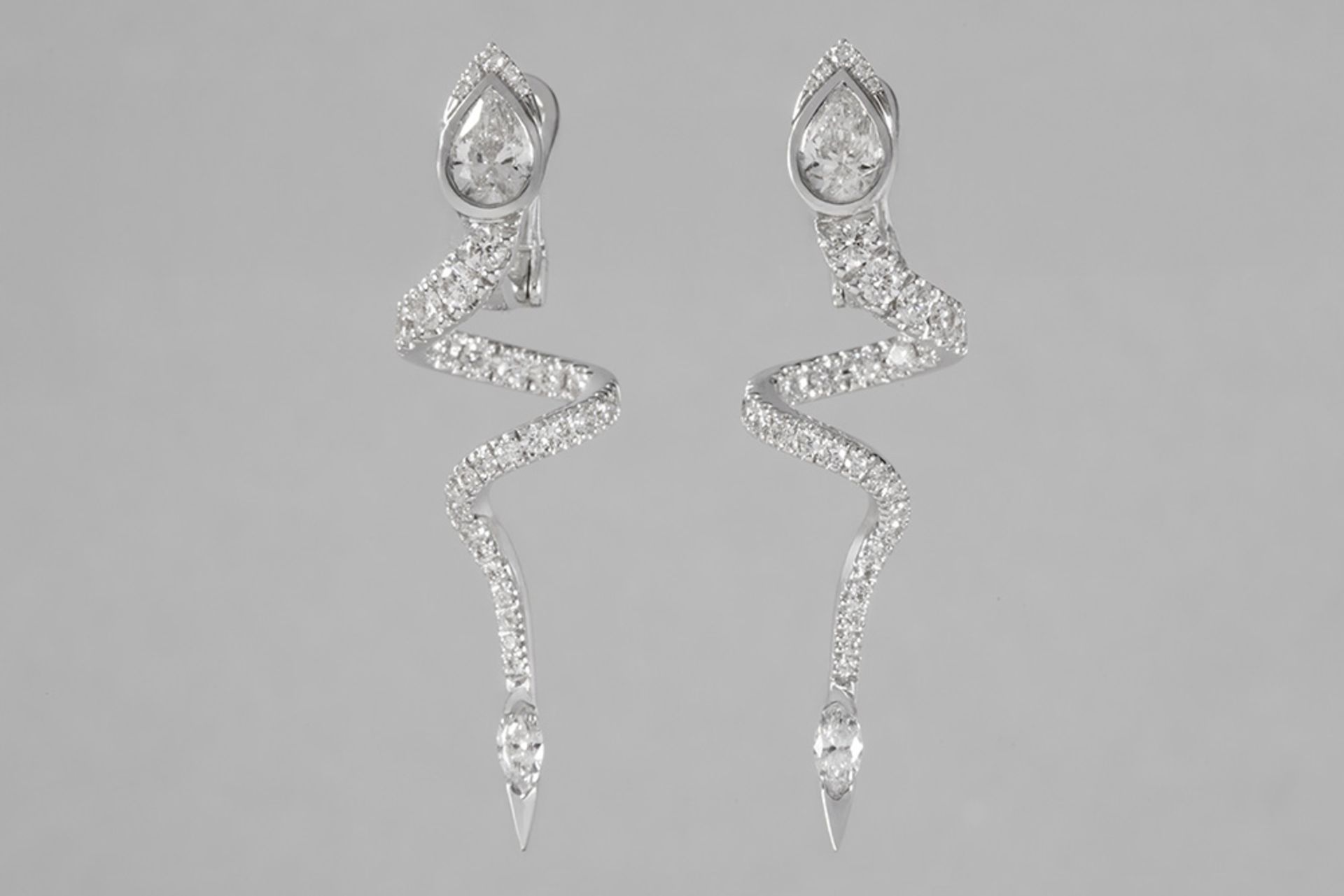 matching pair of "Clem Vercammen Collection" earrings in white gold (18 carat) with a snake motif wi