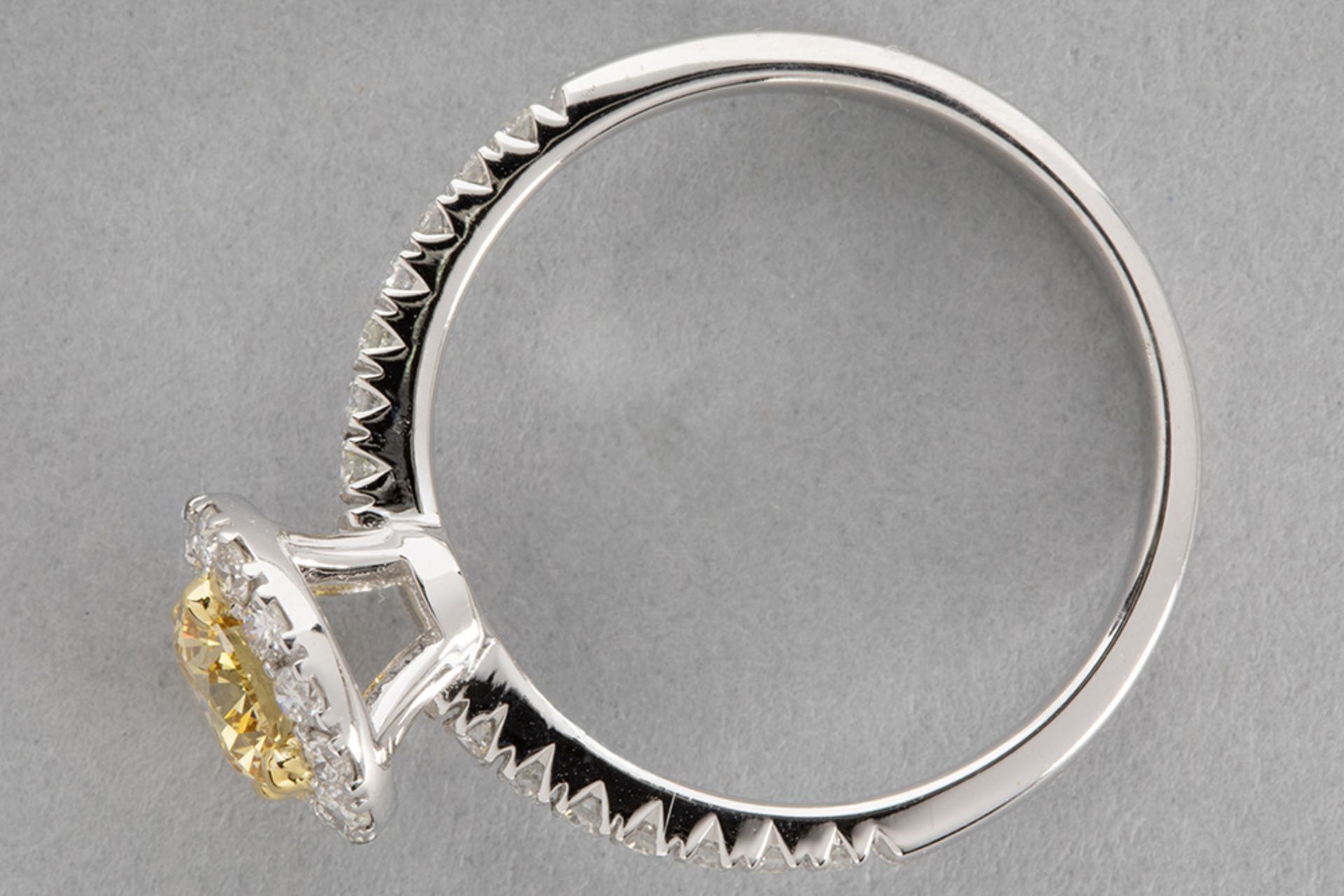 a 0,71 carat natural fancy "Intense Yellow-Orange color high quality brilliant cut diamond set in a  - Bild 2 aus 3