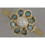 ring in yellow gold (18 carat) with at least 0,55 carat brilliants (one white and eight blue ones)