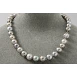superb necklace with 37 real Tahiti pearls with a beautiful color and luster & with a lock in white 
