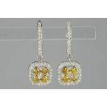 pair of earrings in white gold (18 carat) with ca 0,75 carat of natural "Orange Vivid" fancy color h