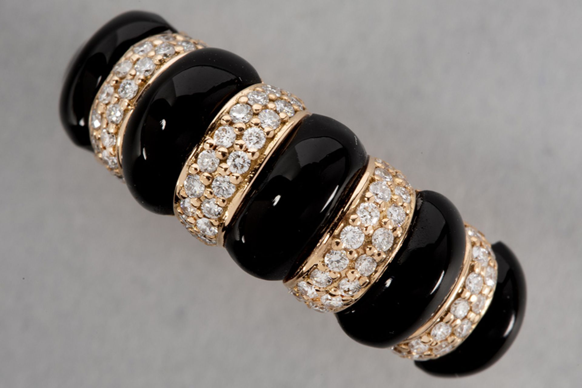 ring with a "Chaumet" style design in pink gold (18 carat) with onyx and high quality brilliant cut 