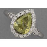 a 1,03 carat natural fancy Vivid Greenish Yellow color high quality brilliant cut diamond set in a r