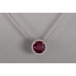 pendant with classic cluster model in white gold (18 carat) with a ca 4,50 carat round  cut ruby sur