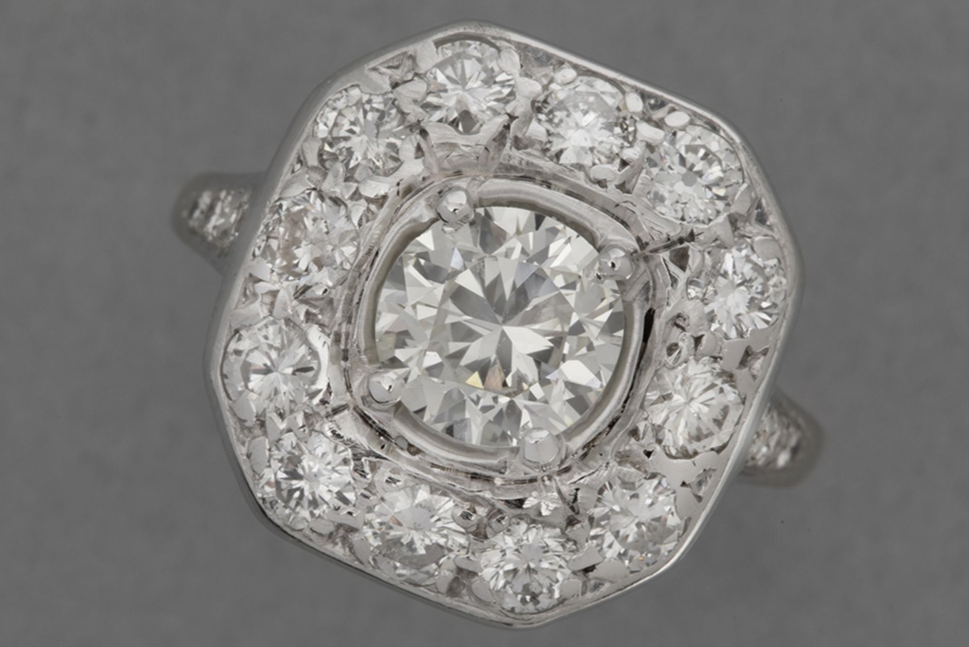 late Art Deco ring in yellow and grey gold (18 carat) with a 0,98 carat quality brilliant cut diamon