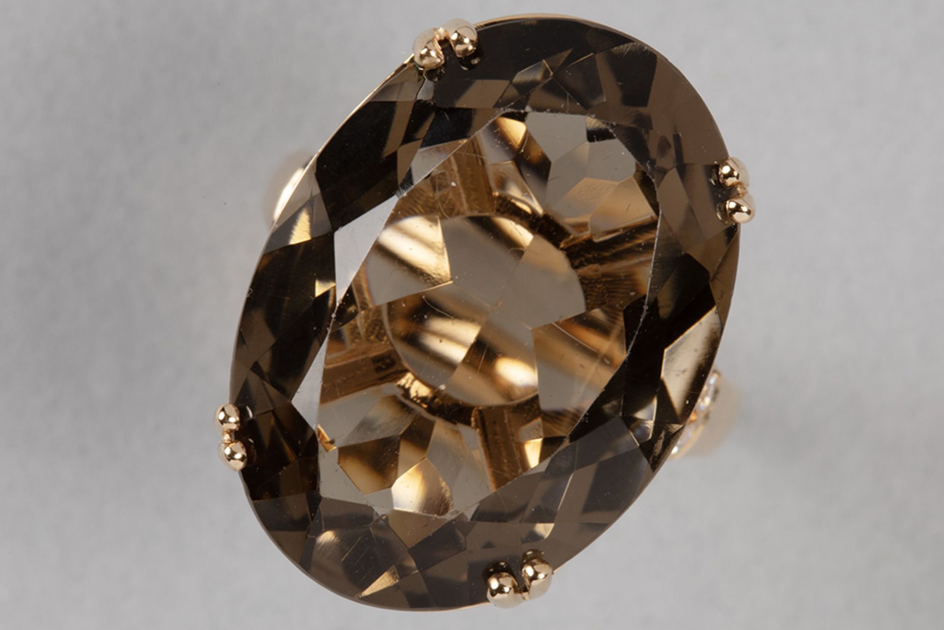 nice contemporary ring in pink gold (18 carat) with a big 20 carat topaz and ca 0,25 carat of high q