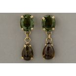 pair of earrings in yellow gold (18 carat) with ca 8 carat of green and purple tourmaline
