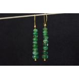 pair of earrings in yellow gold (22 carat) with ca 23 carat of emeralds and each with a small brilli
