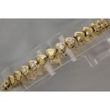 bracelet with heart-shaped links in yellow gold (18 carat) and with ca 1 carat of high quality brill