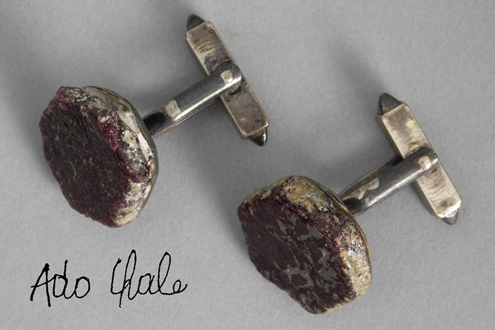 pair of Chale cuff-links in silver each with a plaque in (rough) ruby - with their Chale marked box