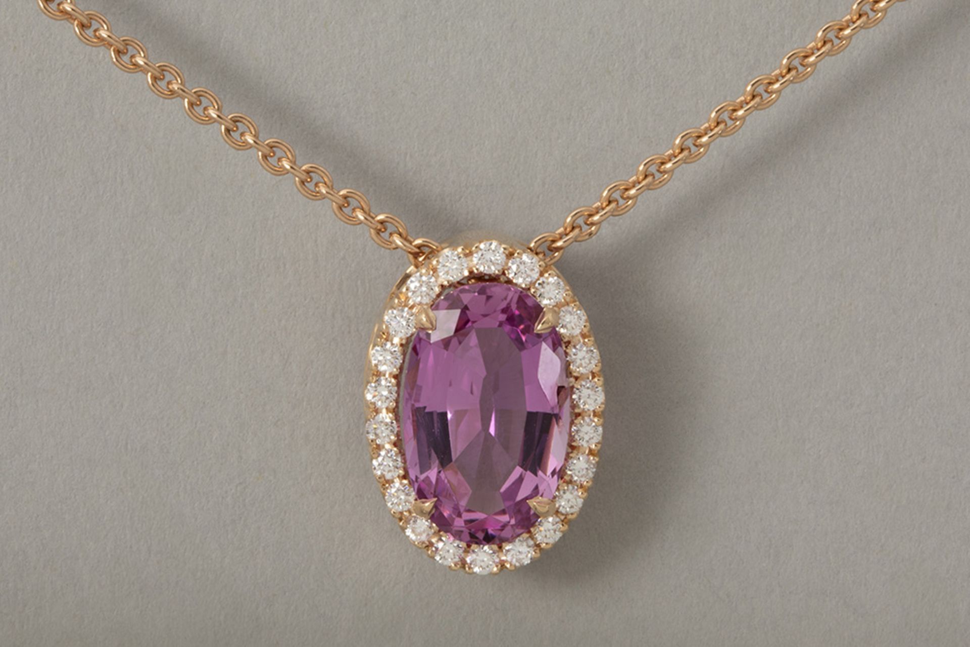 delicate 18-karat rose gold necklace with an oval pendant featuring a very important 3.08 carat "Imp