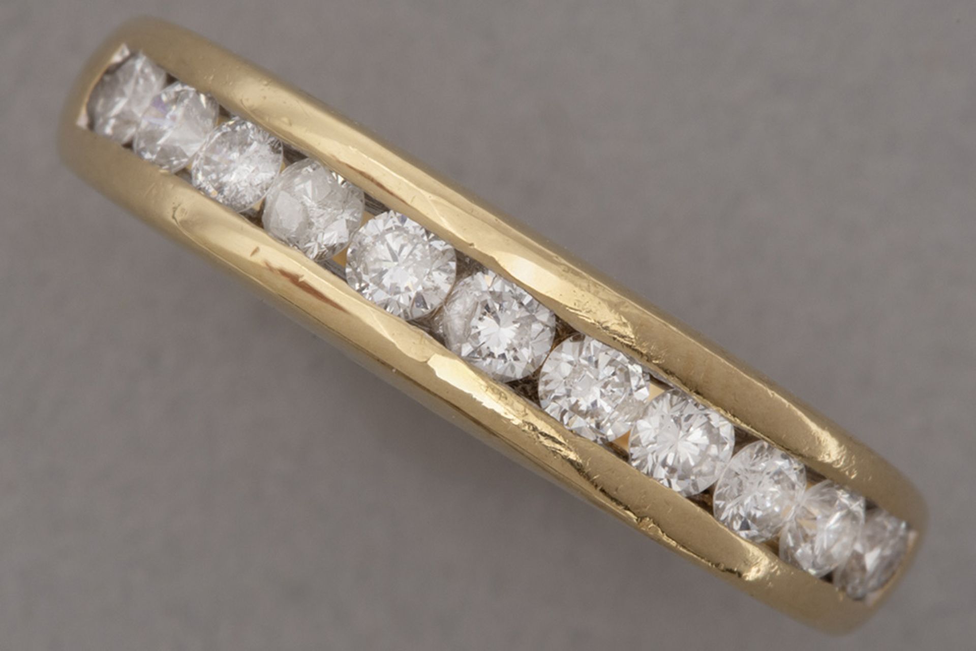 (wedding) ring in yellow gold (18 carat) with ca 0,40 carat of quality brilliant cut diamonds