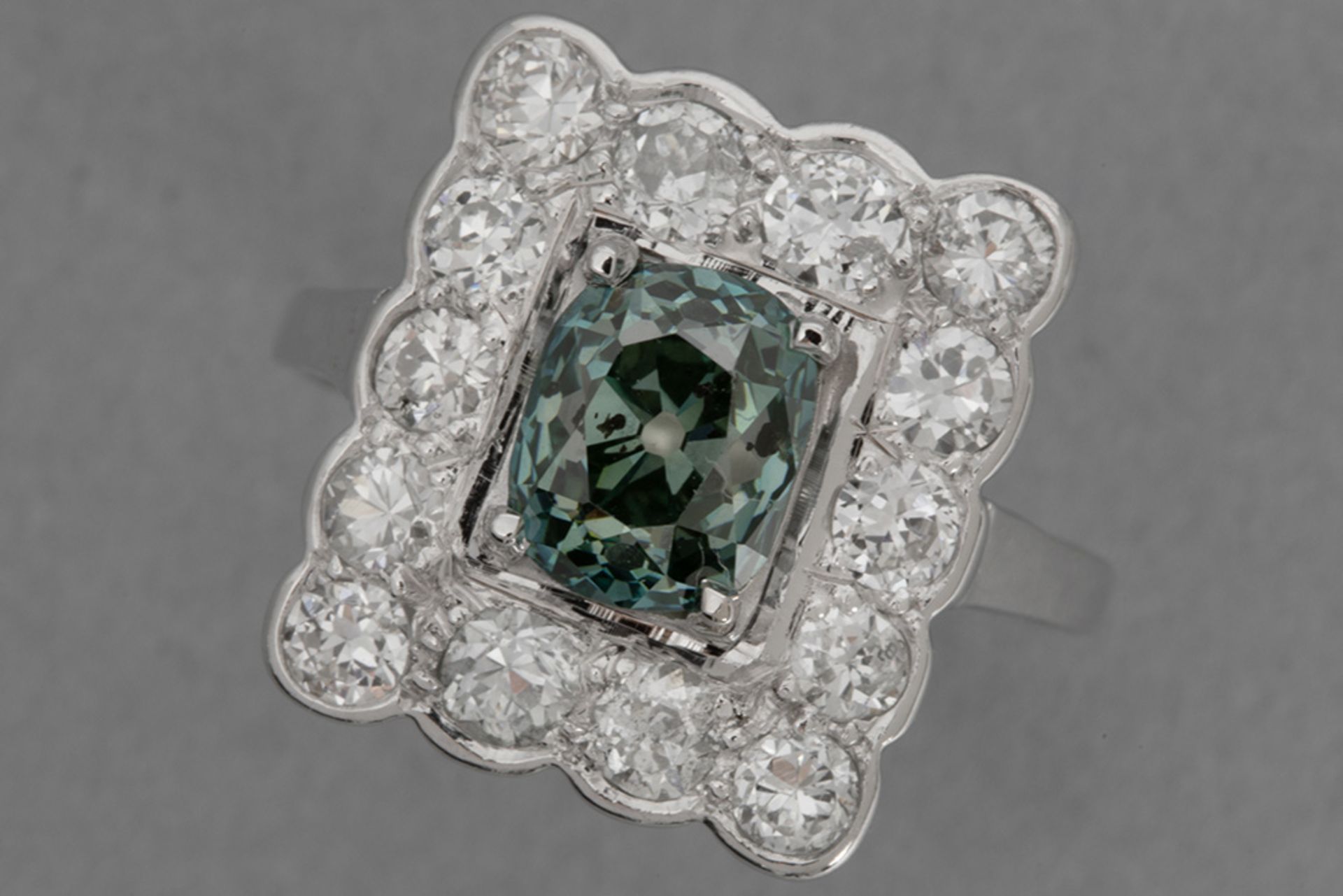 classy ring in platinum with a 1,45 carat natural "Vivid Blue-Green" color quality cushion cut diamo